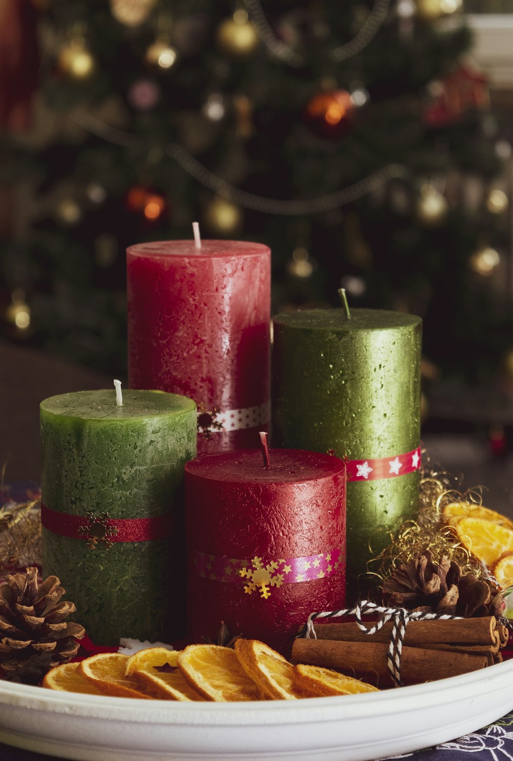 red and green candles on white tray