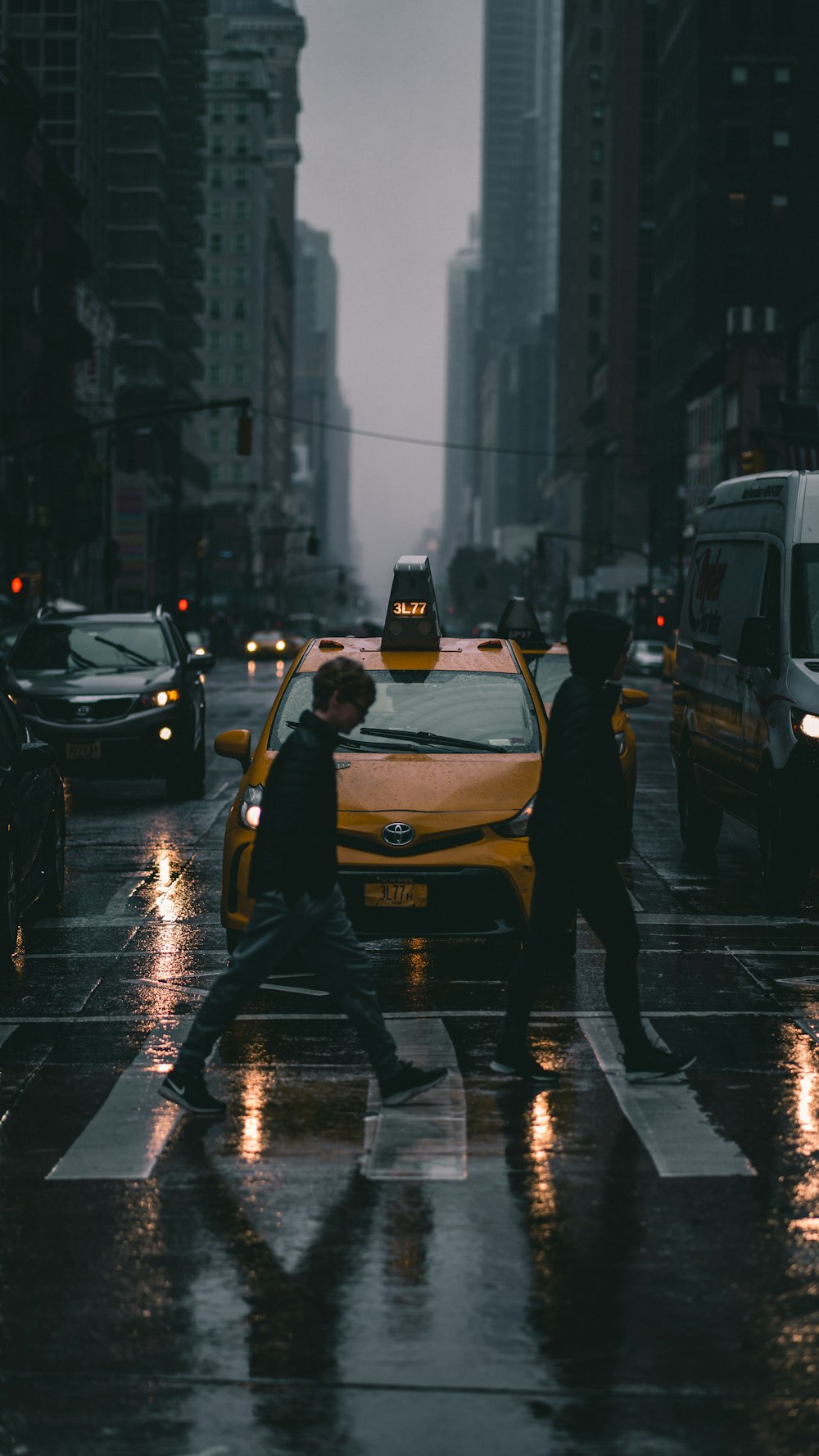 two person walking on pedestrian lane