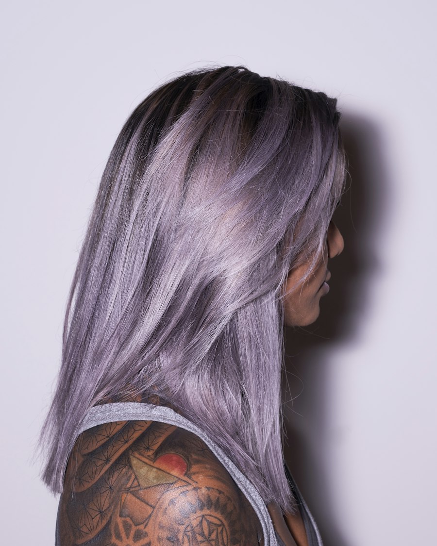 Long straight hair in a soft lilac shade, seen in profile.