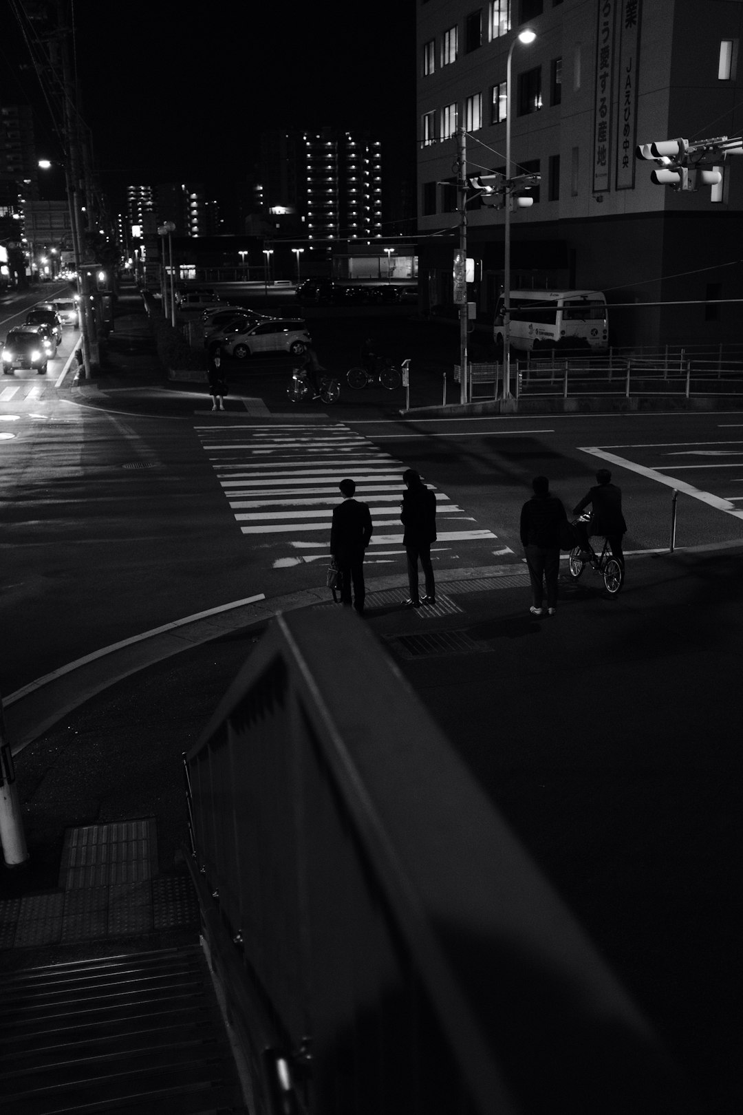 grayscale photography of people crossing pedestrian lane