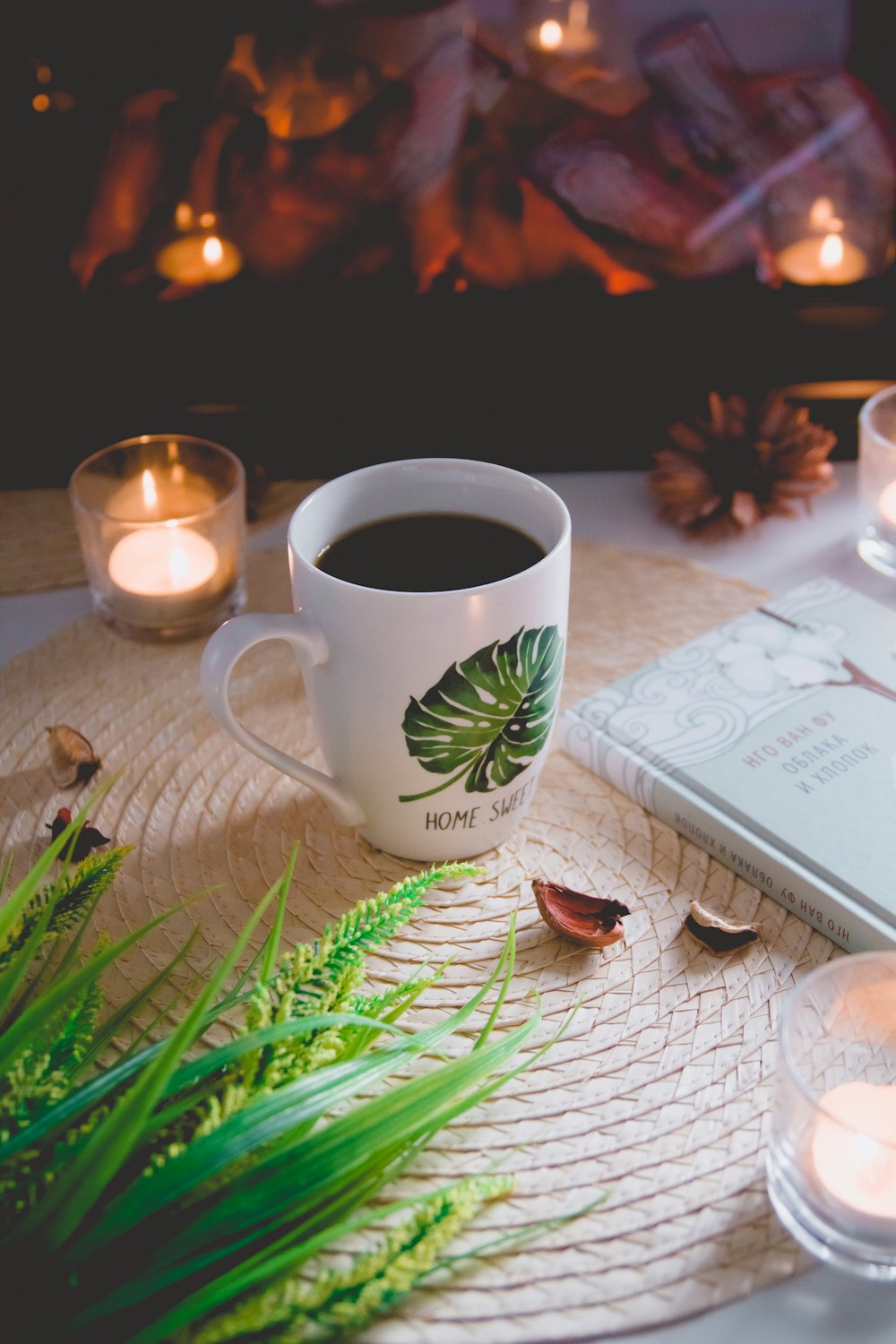 white and green ceramic mug