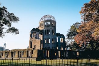 trees beside brown concrete building