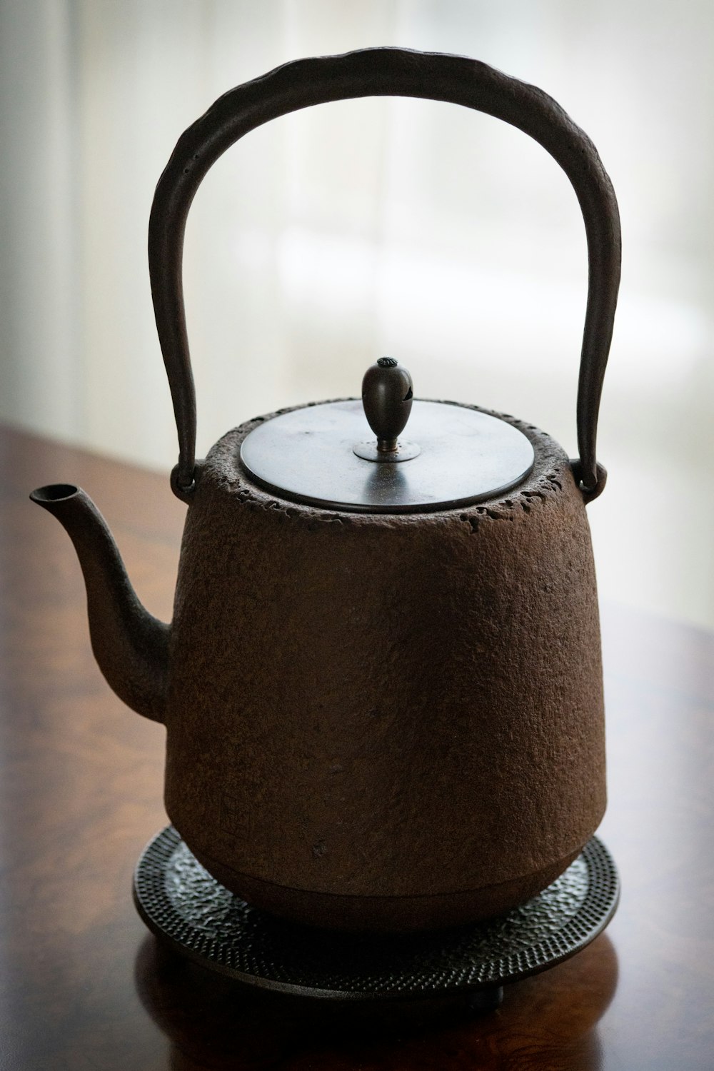 brown teapot on brown surface