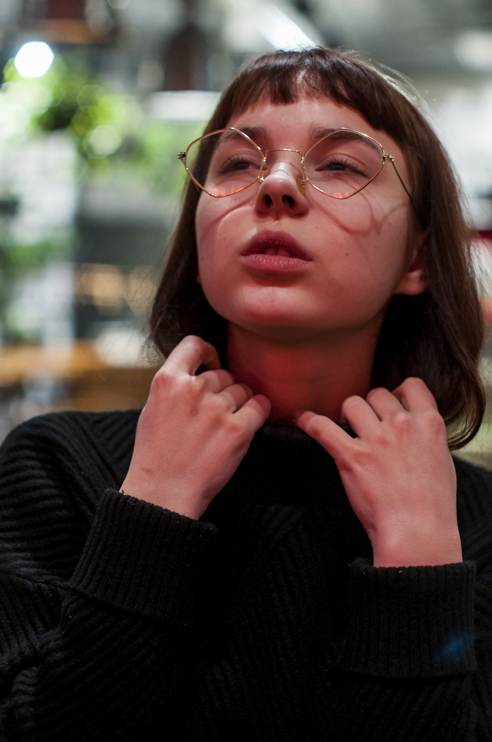 closeup photo of woman wearing eyeglasses
