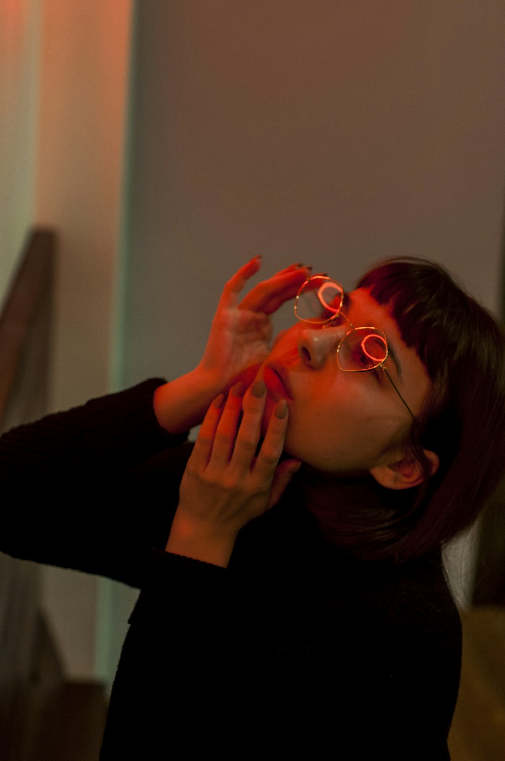 close-up photography of woman touching her face