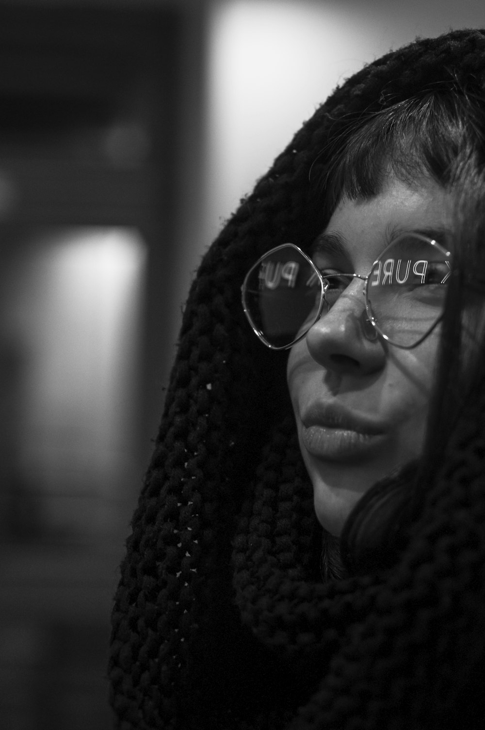 woman wearing eyeglasses and black scarf