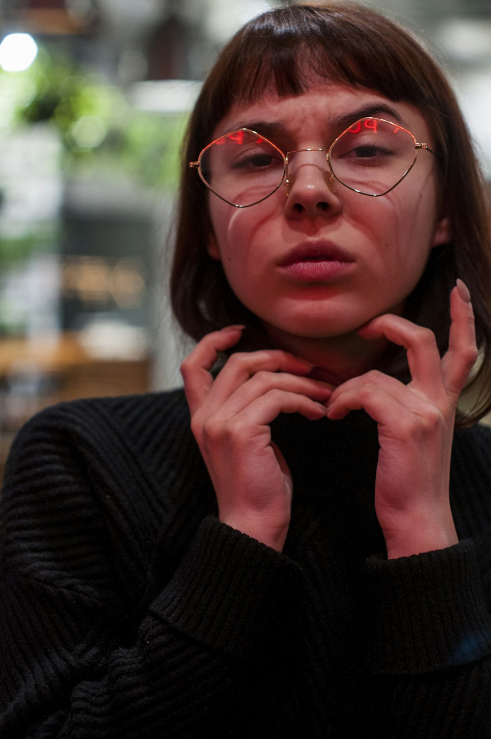 woman wearing black crew-neck sweawter