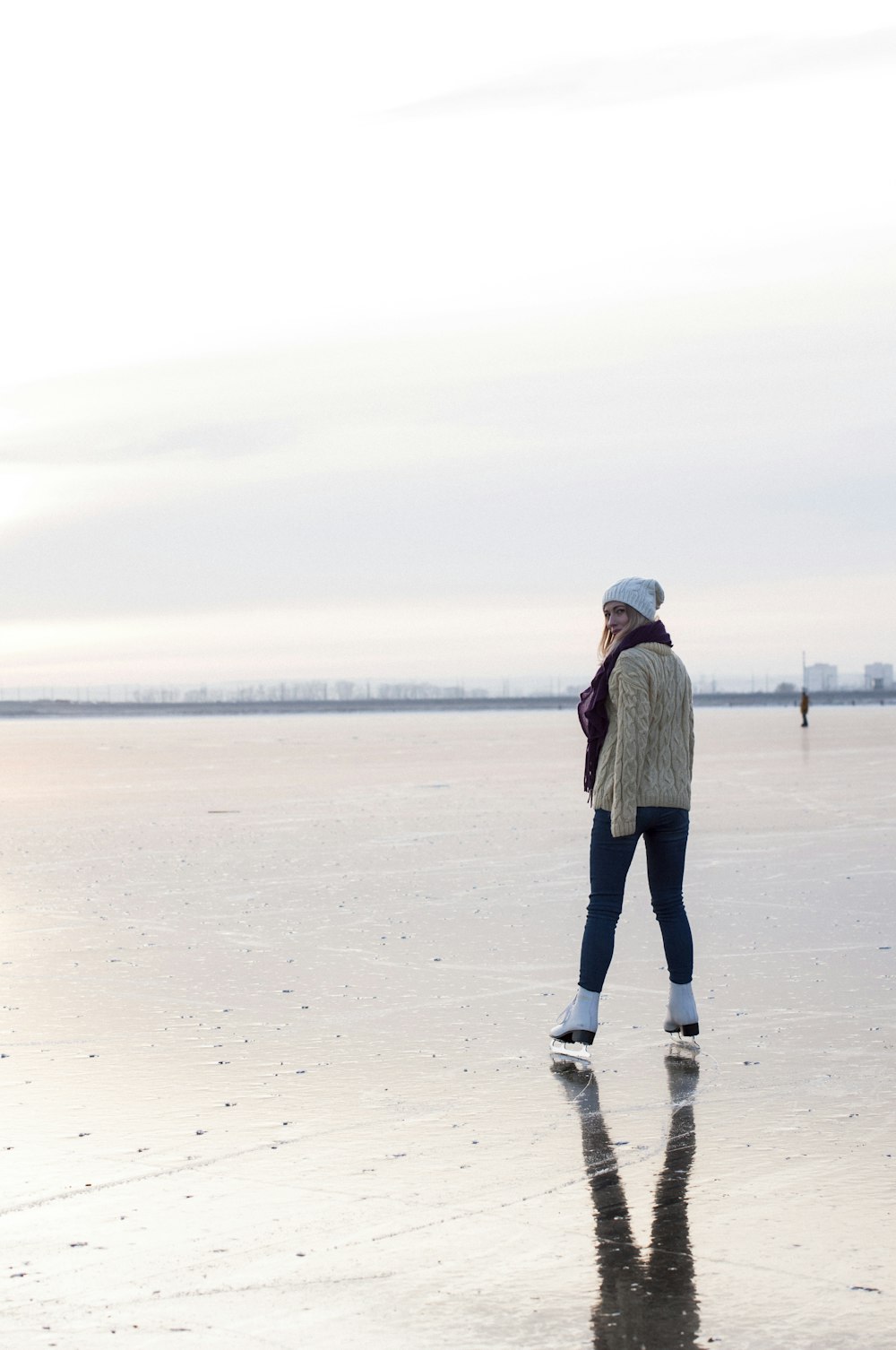 woman ice skating during daytime