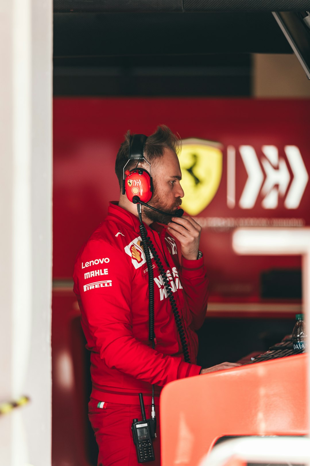 selective focus photo of man wearing black and red headphones