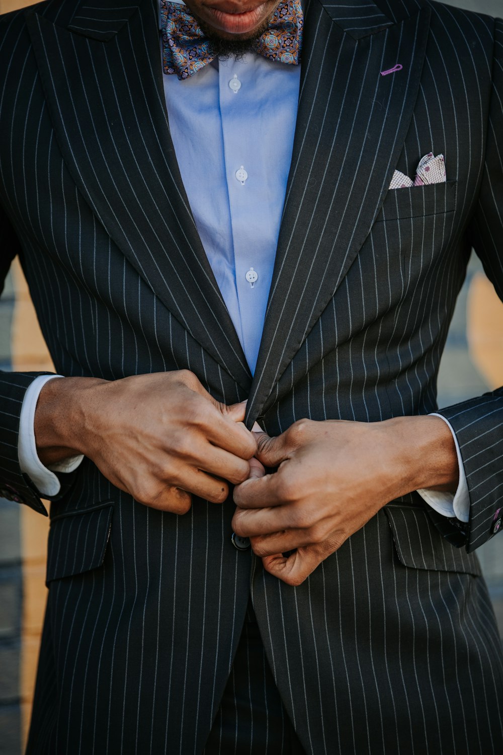 man wearing balck suit jacket