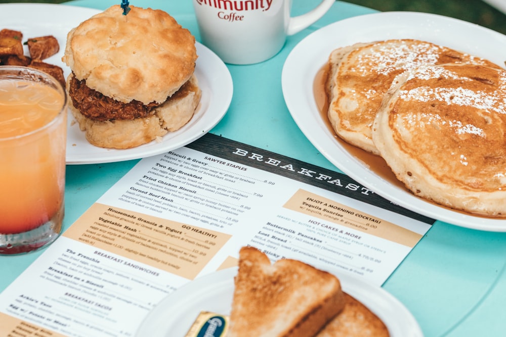 two plates of pastries on green table