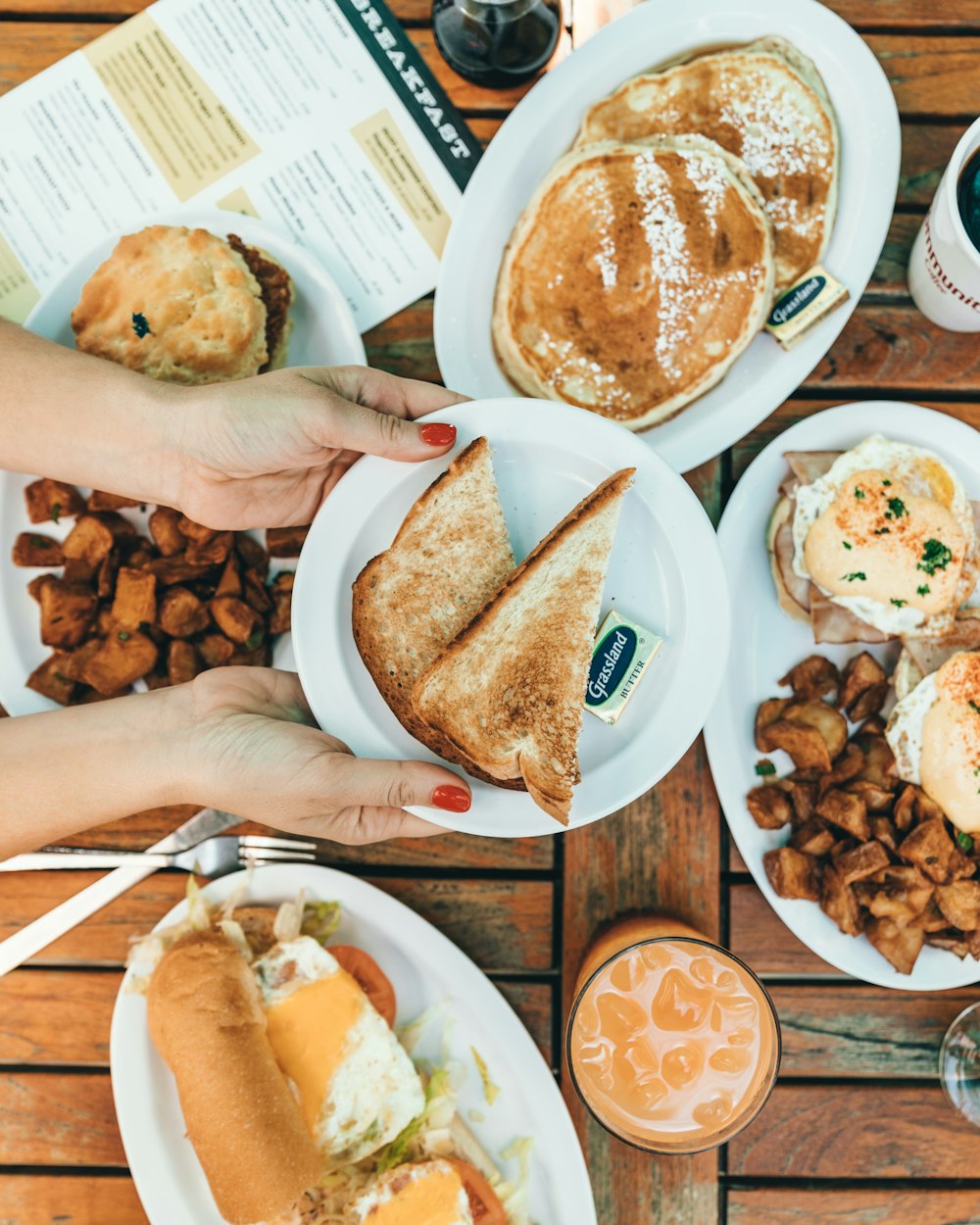 person holding plate with loaf bread