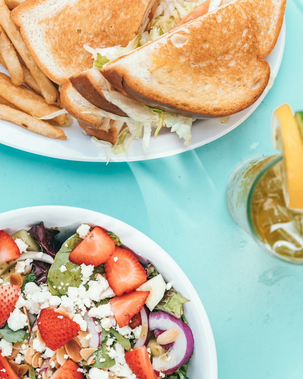 bowl of salad and plate of bread