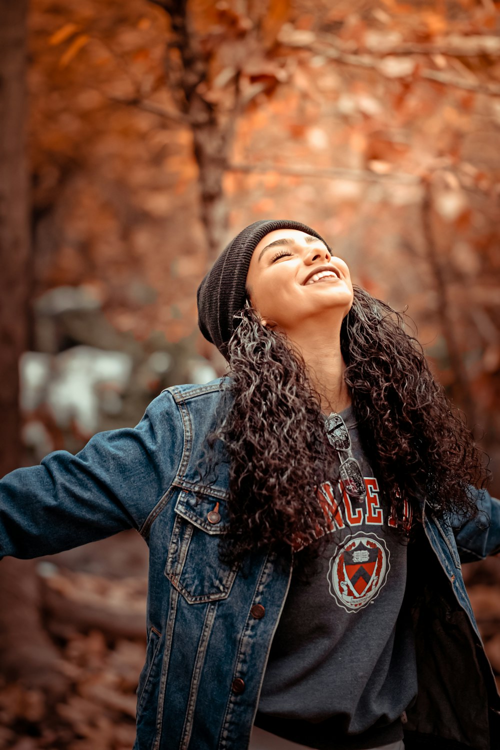 woman wearing blue denim button-up jacket