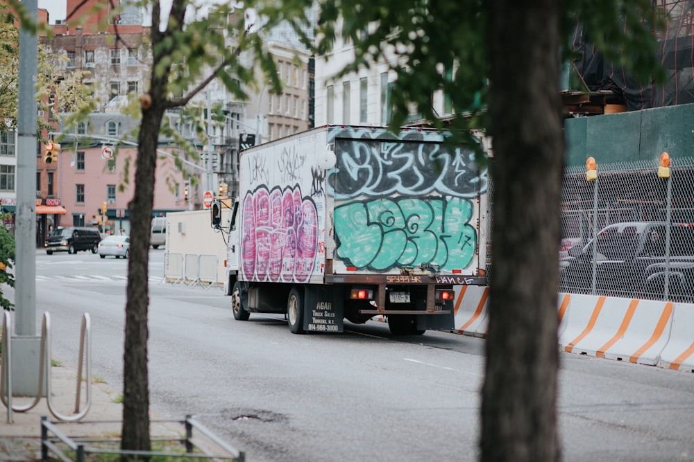 white enclose van on road