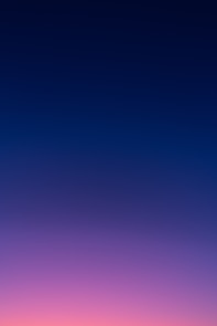 a group of people standing on top of a beach