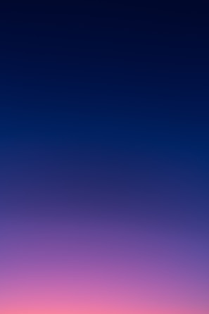 a group of people standing on top of a beach