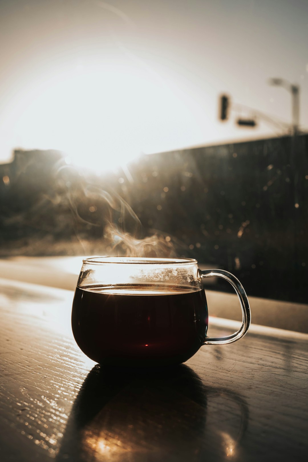 clear glass cup filled with brown liquid