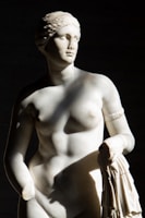 Elegant marble statue capturing soft curves and textures under natural light.
