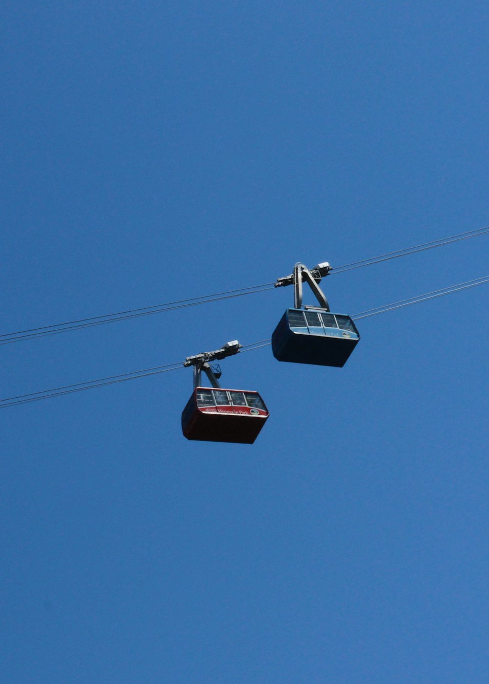 two red and blue cable cars
