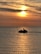 Two customers enjoying a jetski tour with the sun setting over Browns Bay.