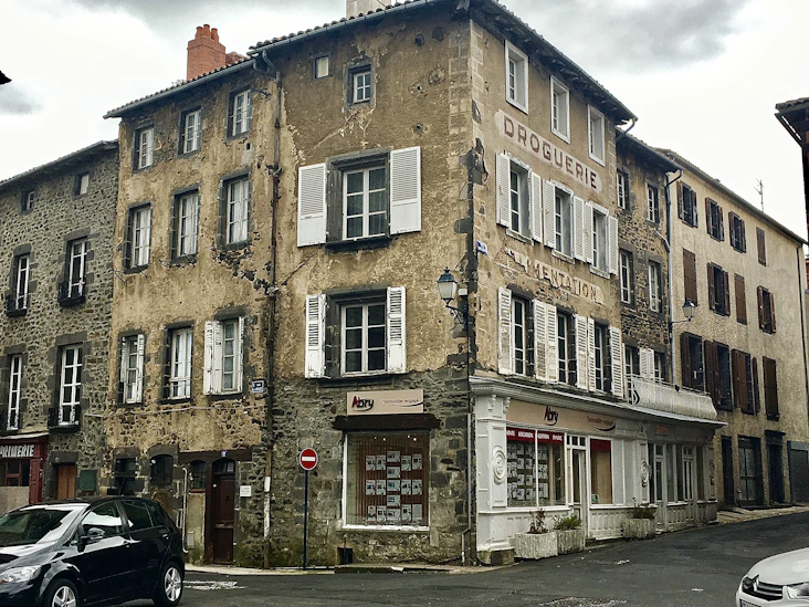 black SUV parked behind house