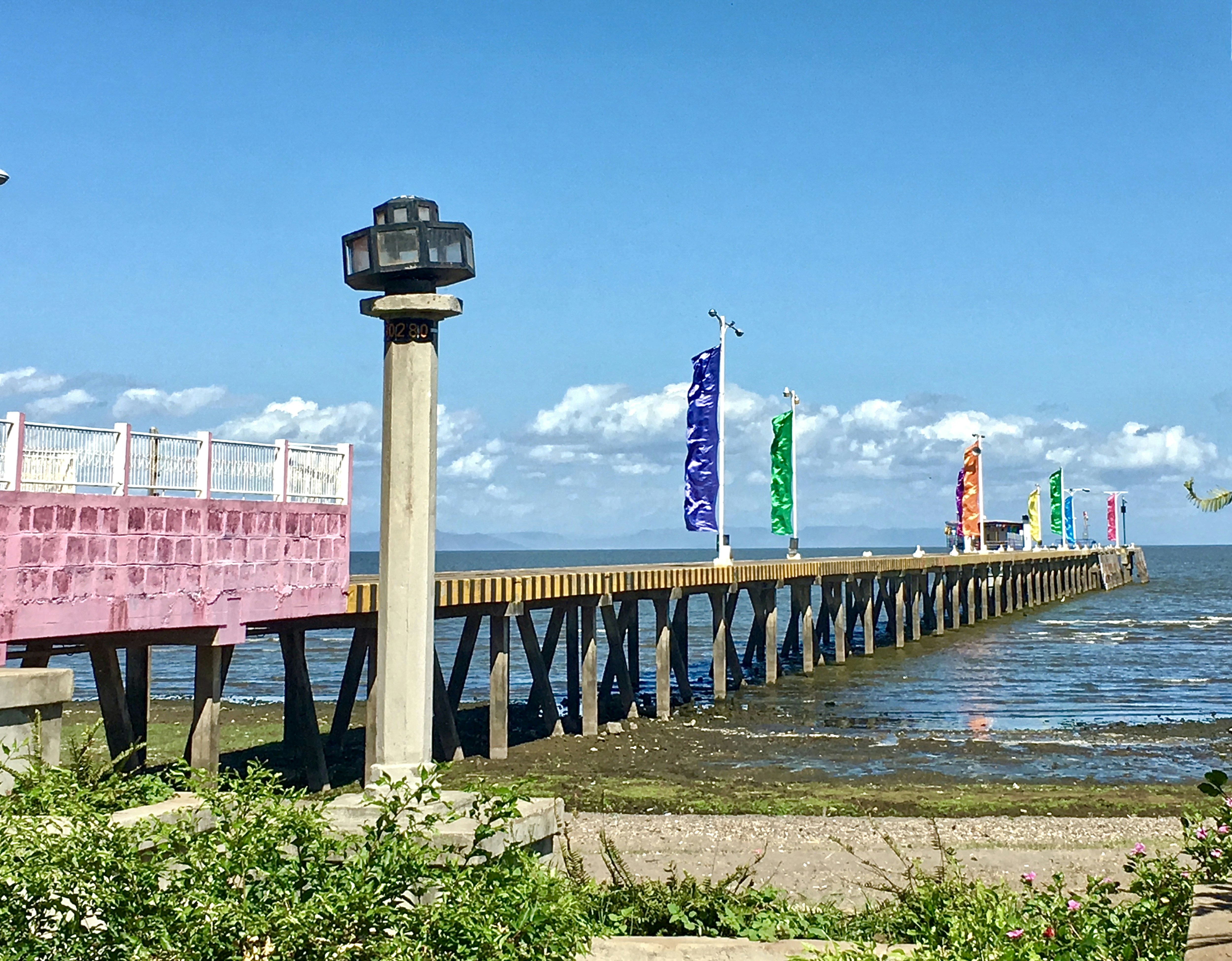 gray concrete dock with banners