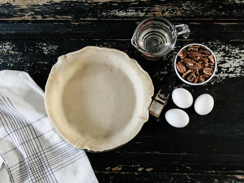 Bird's-eye flat-lay overhead photo of a white plate beside three eggs