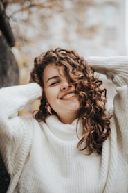 woman wearing white knit sweater during daytime