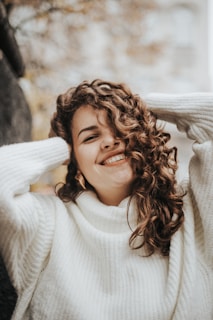 woman wearing white knit sweater during daytime