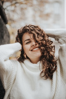 woman wearing white knit sweater during daytime