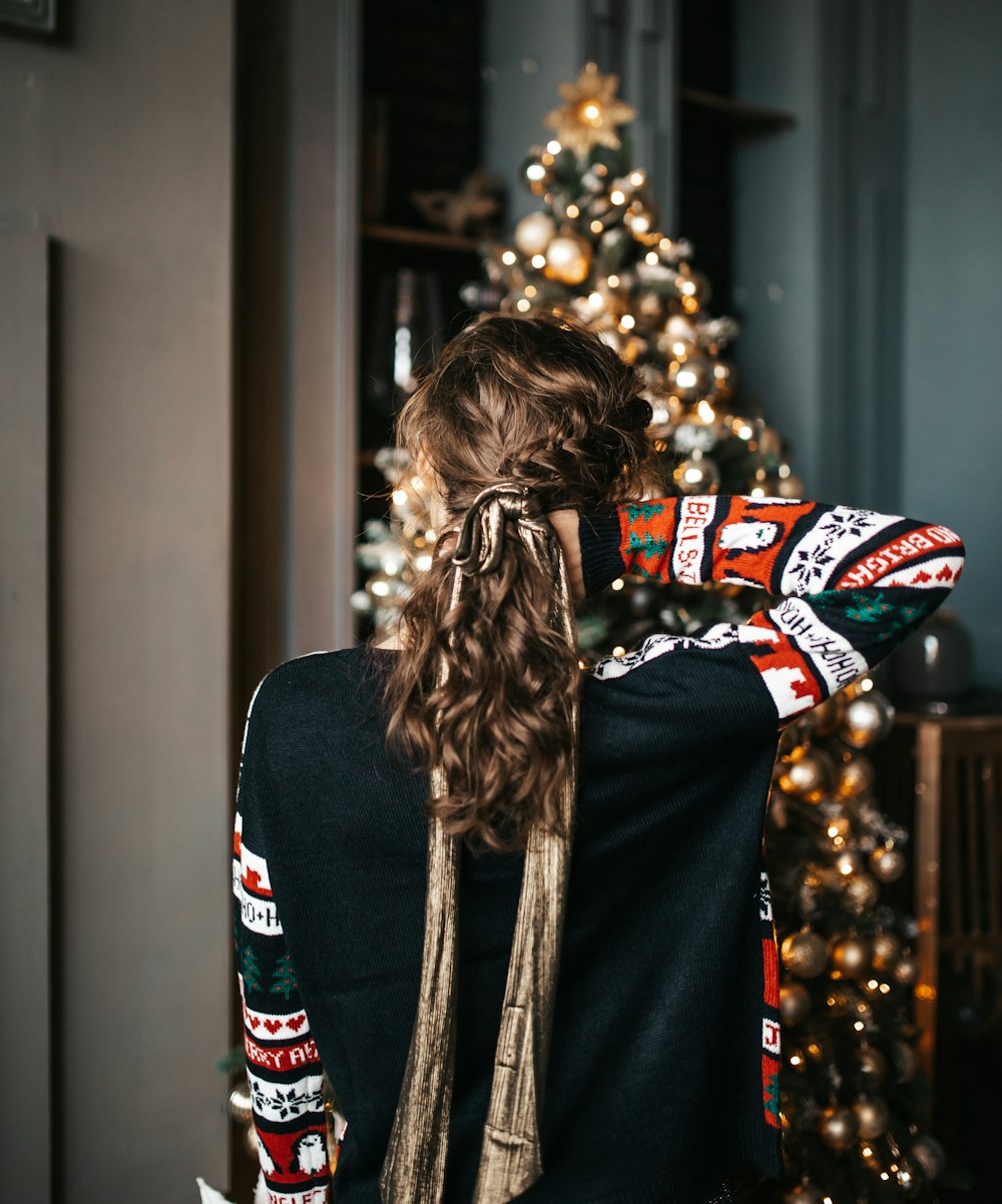 woman wearing black and white floral sweater