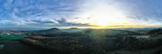 Panoramic terrace overlooking the Umbrian countryside at dawn.
