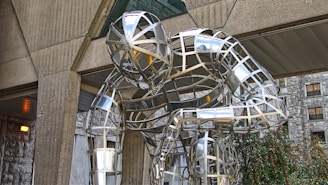 An abstract metal sculpture reflecting human emotion through bold shapes.