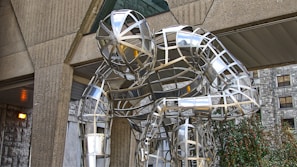 An abstract metal sculpture reflecting human emotion through bold shapes.