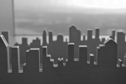 Monochrome image of AI neural network overlaying a cityscape.