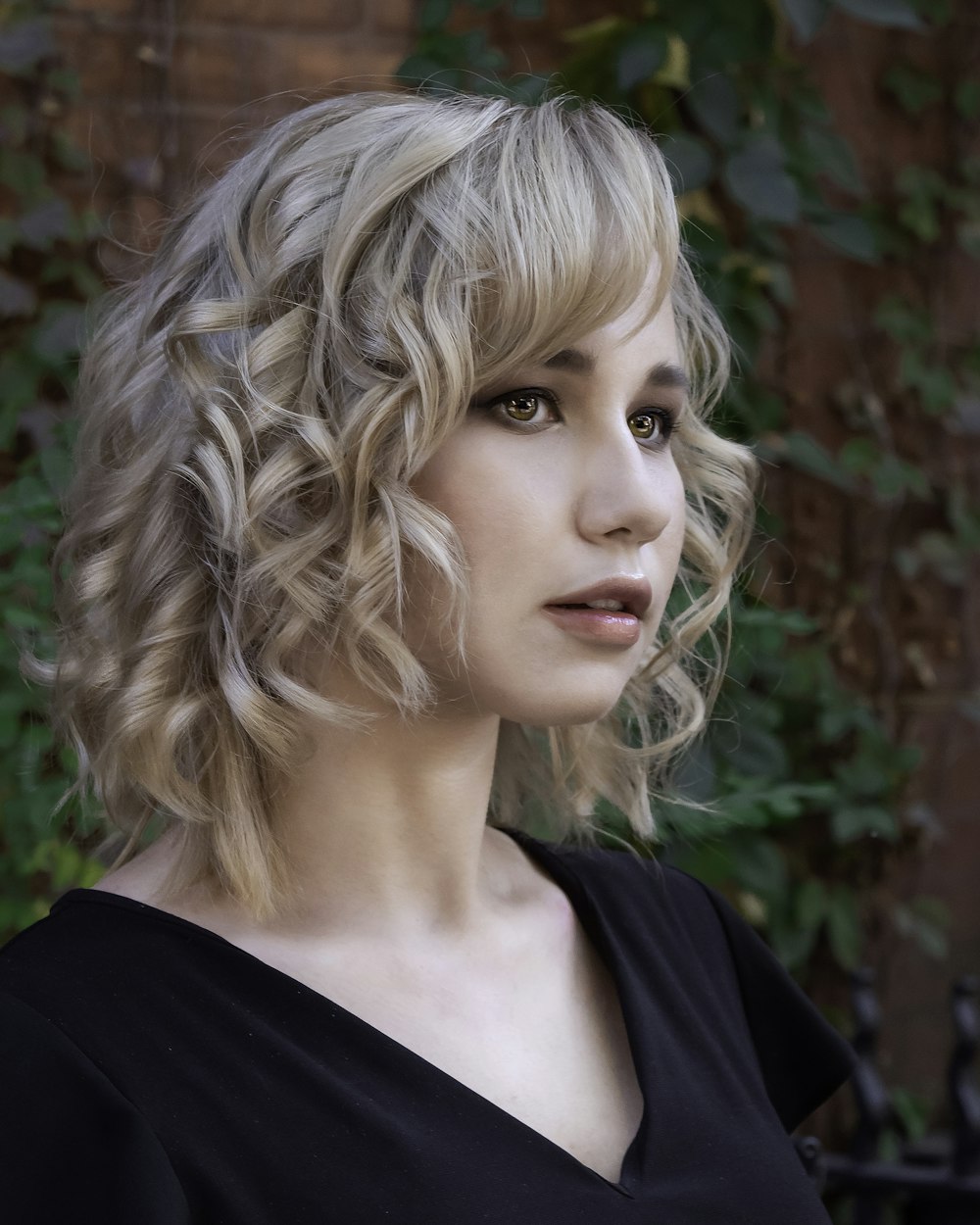 selective focus photography of woman wearing black V-neck top