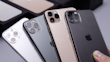 Several smartphones are displayed in a row, showing their back cameras and sleek designs. They feature multiple lenses, indicating advanced photography capabilities. The devices appear to be well-crafted, with a glossy finish in different colors including black, gold, and silver. The iconic logo is visible on each phone.