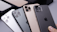 Several smartphones are displayed in a row, showing their back cameras and sleek designs. They feature multiple lenses, indicating advanced photography capabilities. The devices appear to be well-crafted, with a glossy finish in different colors including black, gold, and silver. The iconic logo is visible on each phone.