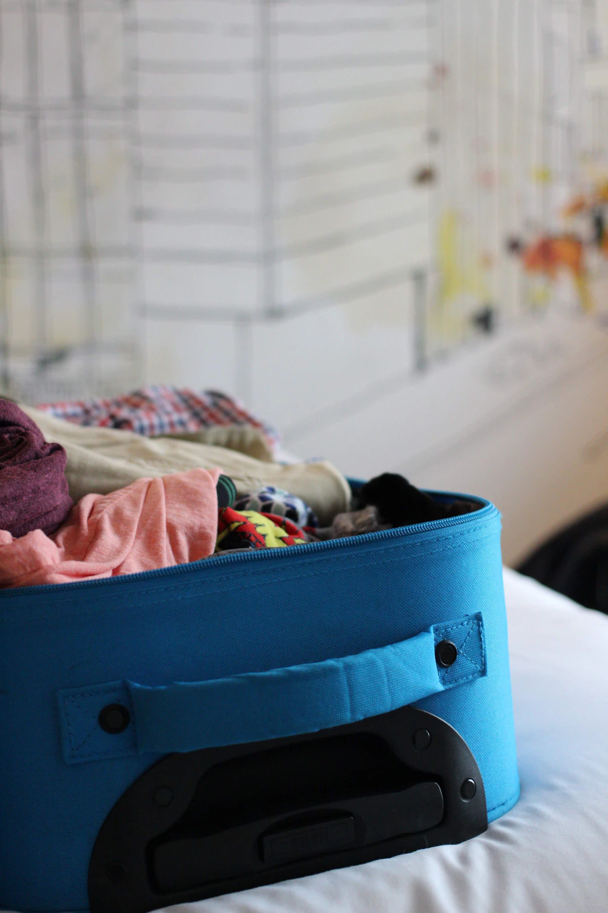 A luggage bag filled with folded clothes