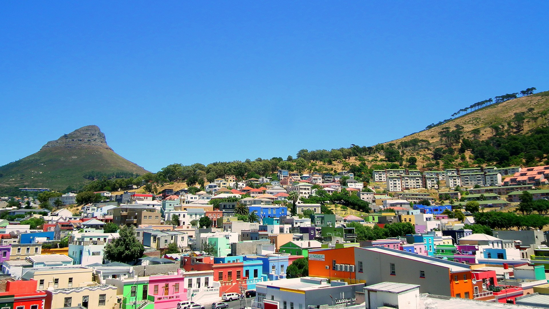woman wearing yellow long-sleeved dress under white clouds and blue sky during daytime