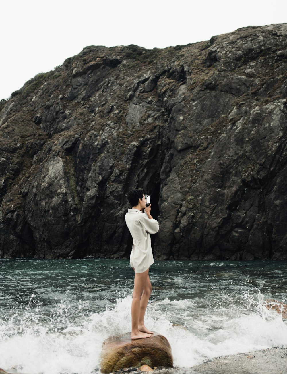 woman standing on rock