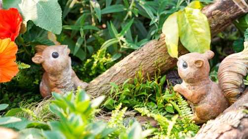 A charming resin animal figure nestled among natural greenery