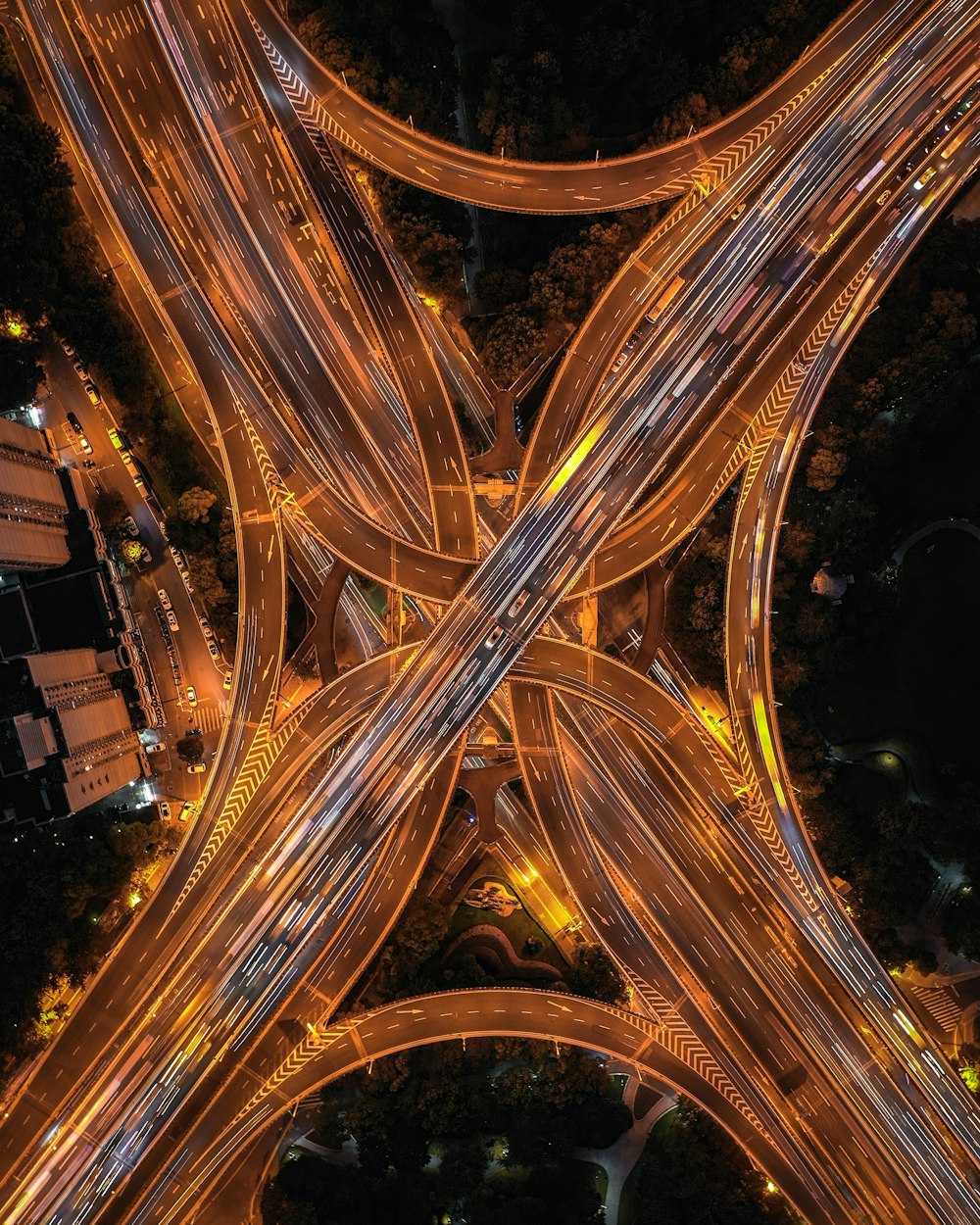 time lapse photography of vehicles on paved road