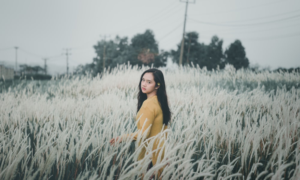 woman standing on grass field