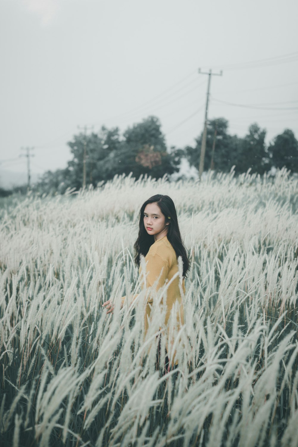 woman standing on grass field