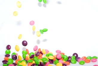 A colorful display of confetti, candies, and lollipops.