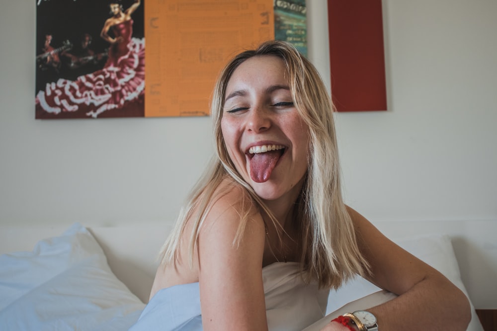 woman licking tongue inside room