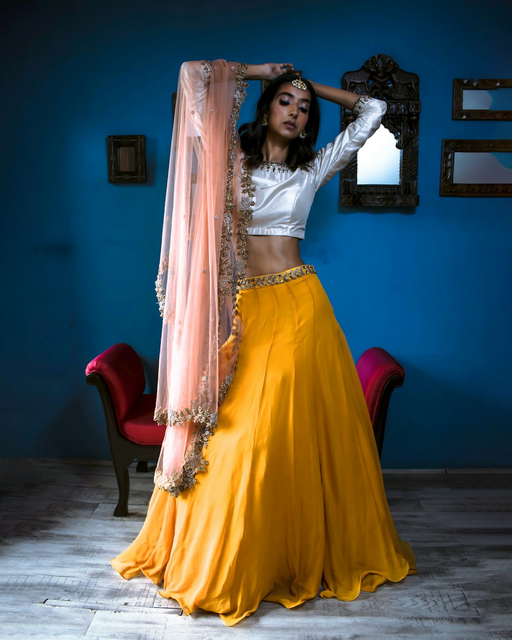 woman wearing white crop top and yellow long skirt