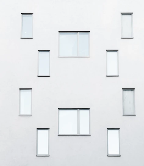 Minimalist architectural detail of a modern building facade in warm neutral tones.